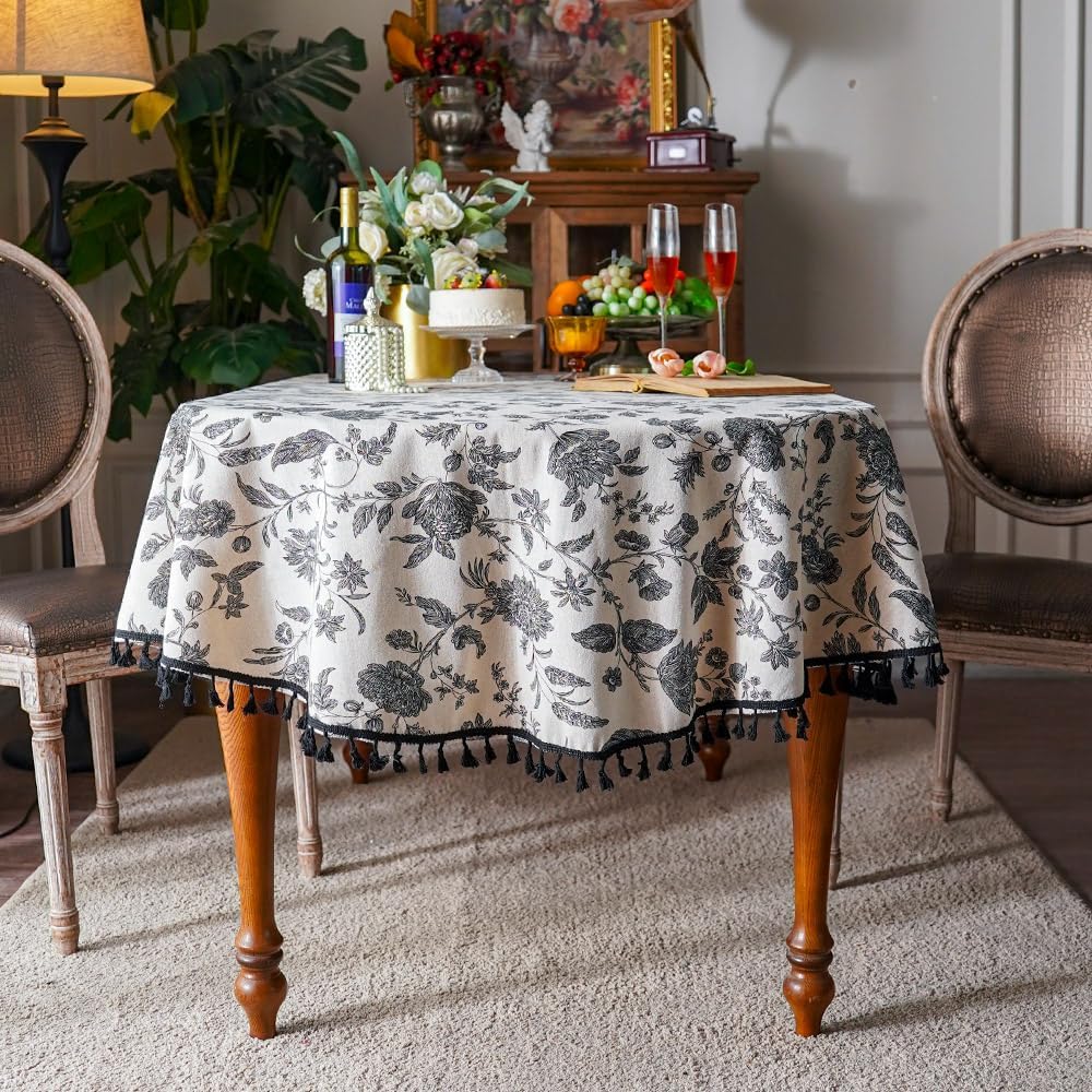 SUTAVIA Boho Cotton Linen Tablecloth Bohemian Black Floral Beige Fabric Tassel Lace Farmhouse Table Top Dust-Proof for Home Kitchen Holiday Party Dining Table (Black Flower, Oval, 60"x102")