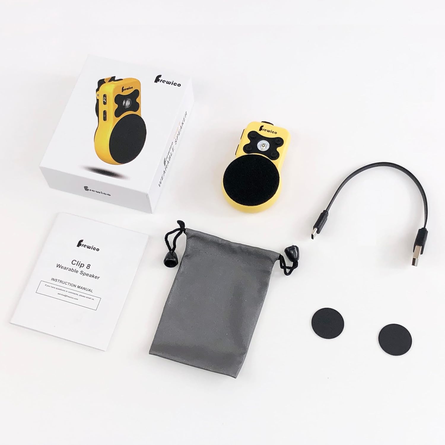 Contents of the Frewico Wearable Bluetooth Speaker box, including the speaker, power cable, instruction manual, carrying pouch, and two magnetic discs.