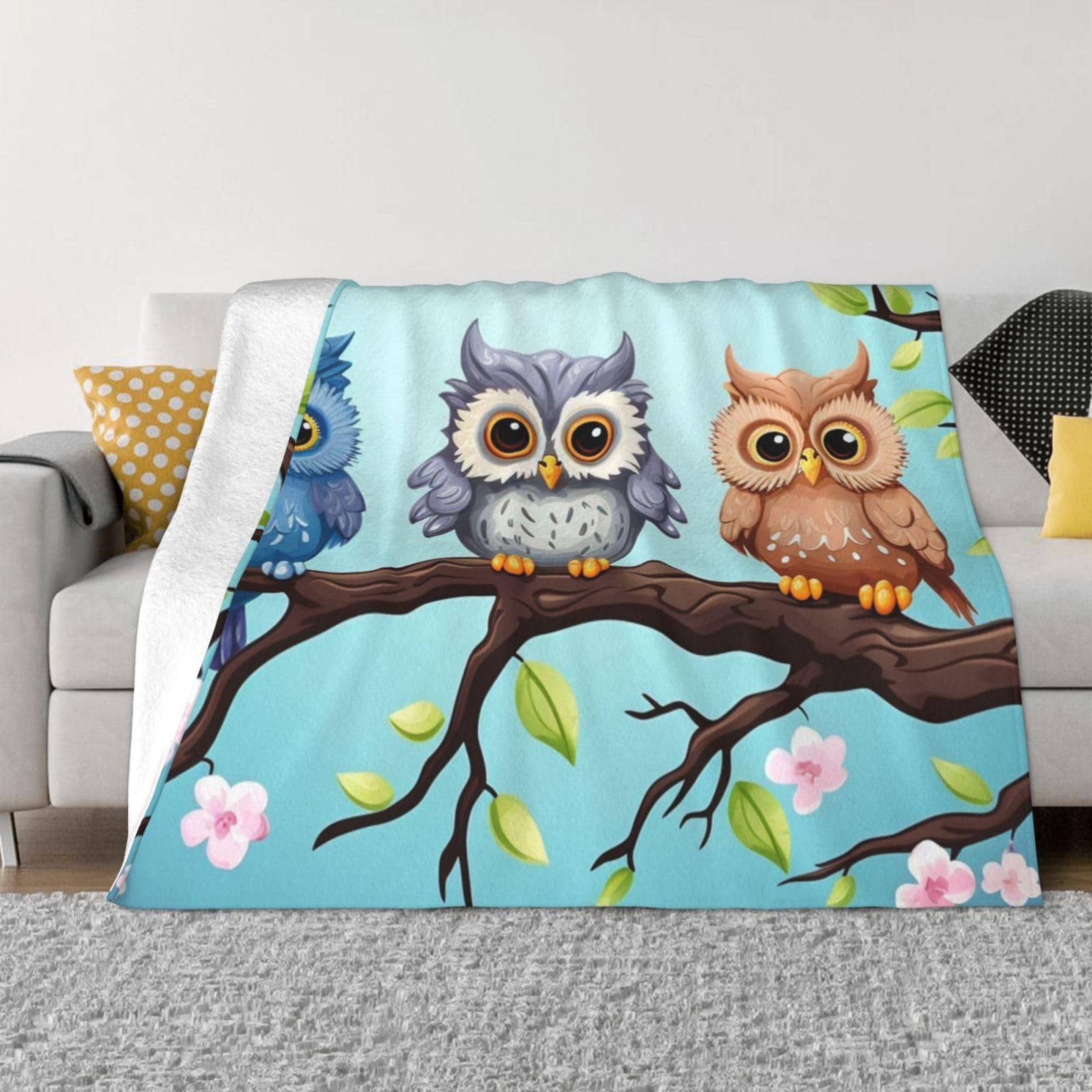 Couverture légère motif chouettes pour vos soirées cocooning au salon