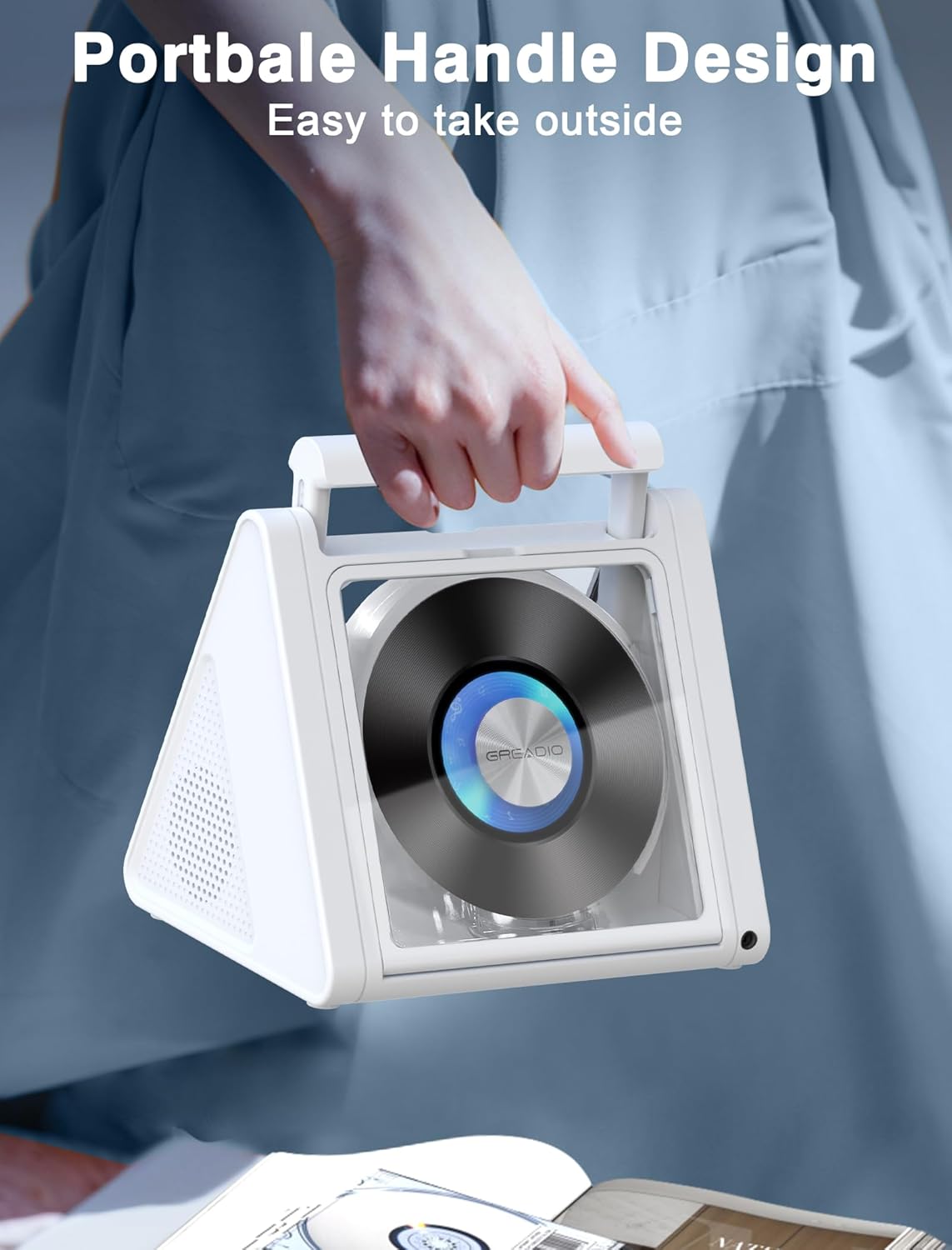 Person holding Greadio CD Player by its portable handle