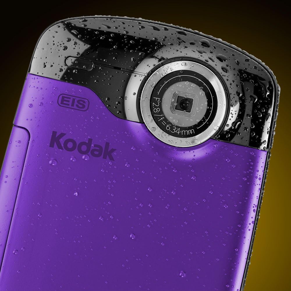Close-up of the camera's rear, showing the lens and water droplets.