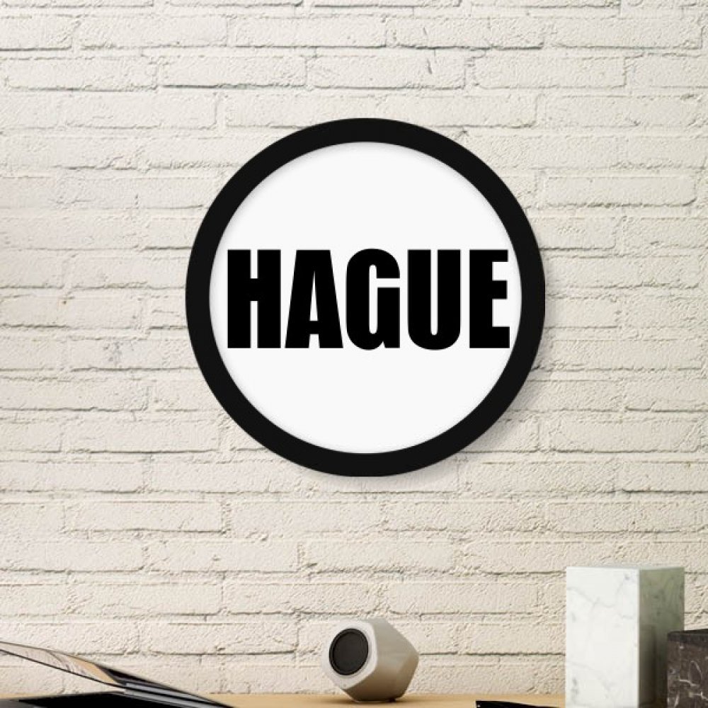 Cadre photo Groningen rond en bois noir pour habiller un mur vide avec style