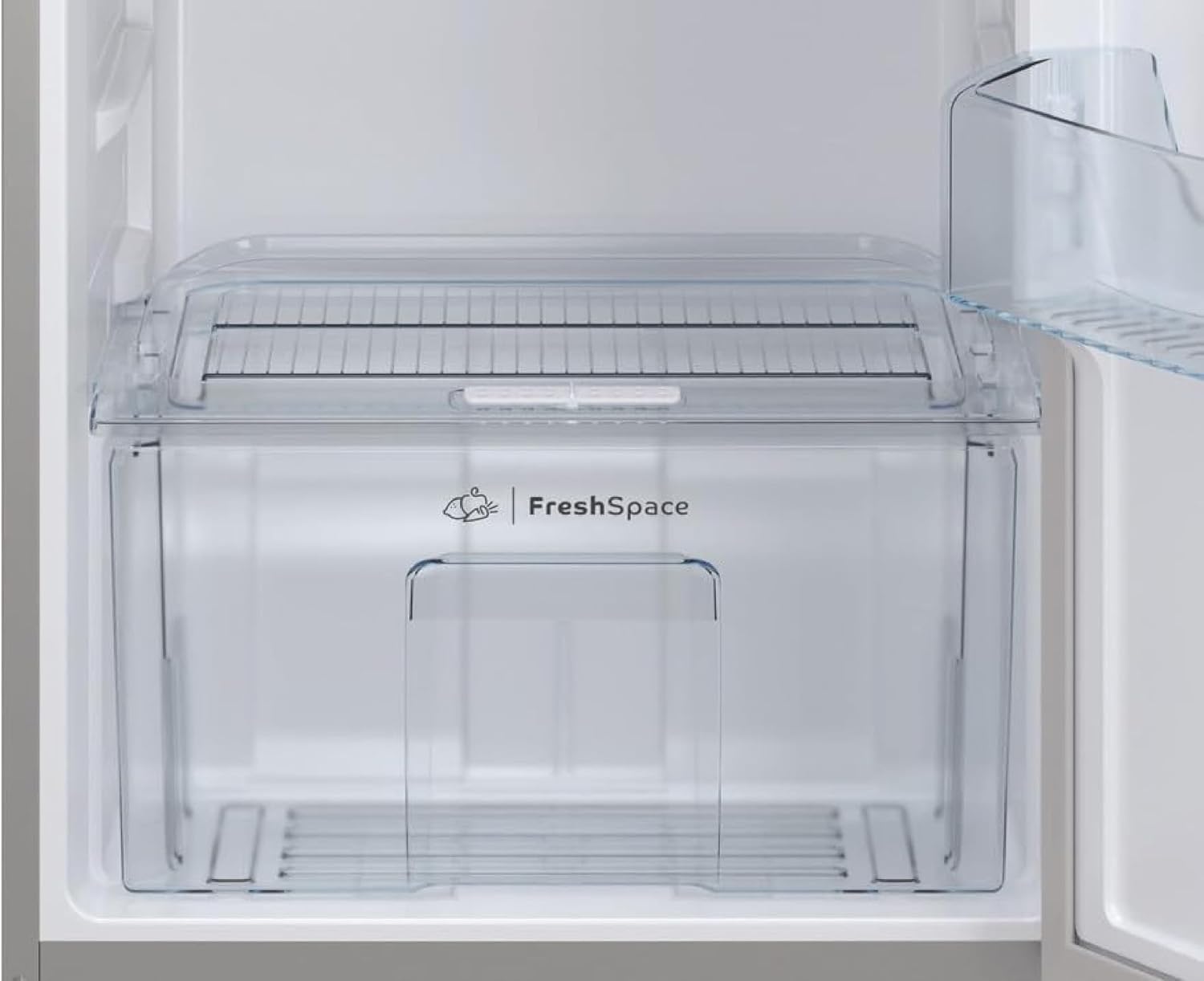 Close-up of the Fresh Space crisper drawer inside the Indesit IT60 732 S refrigerator, designed for fruit and vegetable storage.