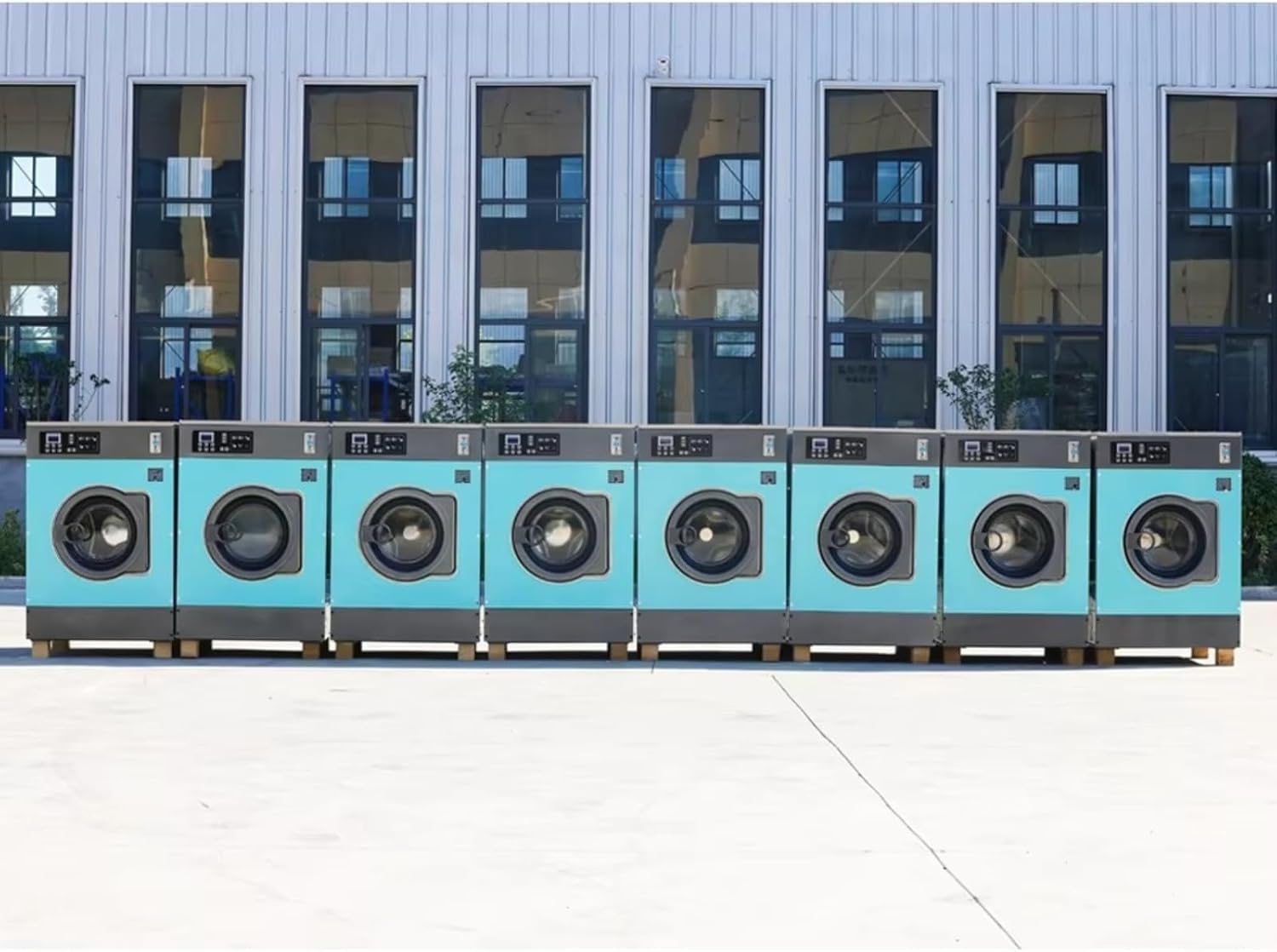 Commercial washing machines and dryers; commercial washing machines - coin and credit card operated, suitable for self-service laundromats.