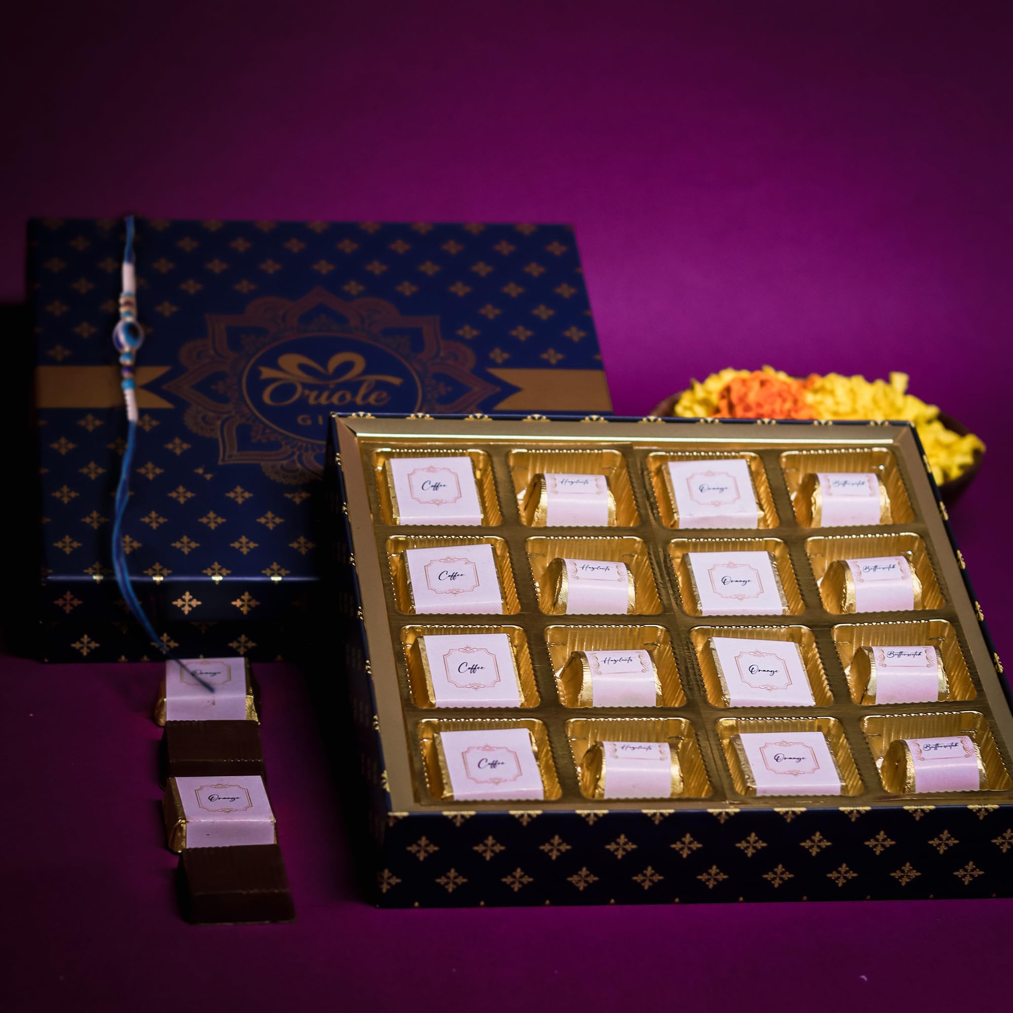 Oriole Gifts Rakhi Gift Hamper for Brother with Premium Chocolates and 1 Evil Eye Rakhi | 16 Premium Chocolates (Coffee, Hazelnut, Butterscoch, Orange) | Rakhi Gift for Brother with Rakhi (B0B786NR4N) Amazon Price History, Amazon Price Tracker