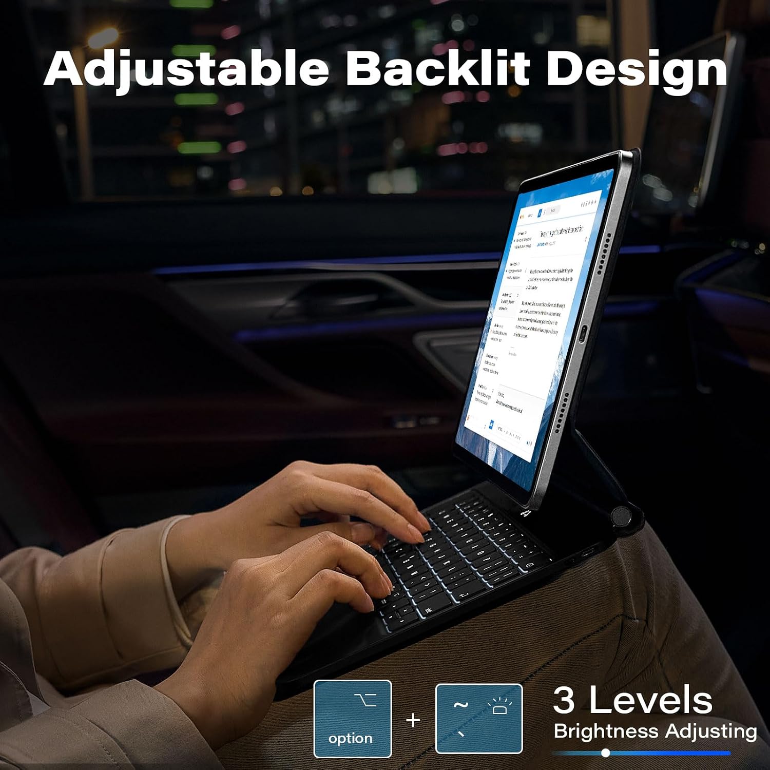 Hands typing on a backlit keyboard in a dimly lit environment, showing the adjustable backlit design with 3 levels of brightness.