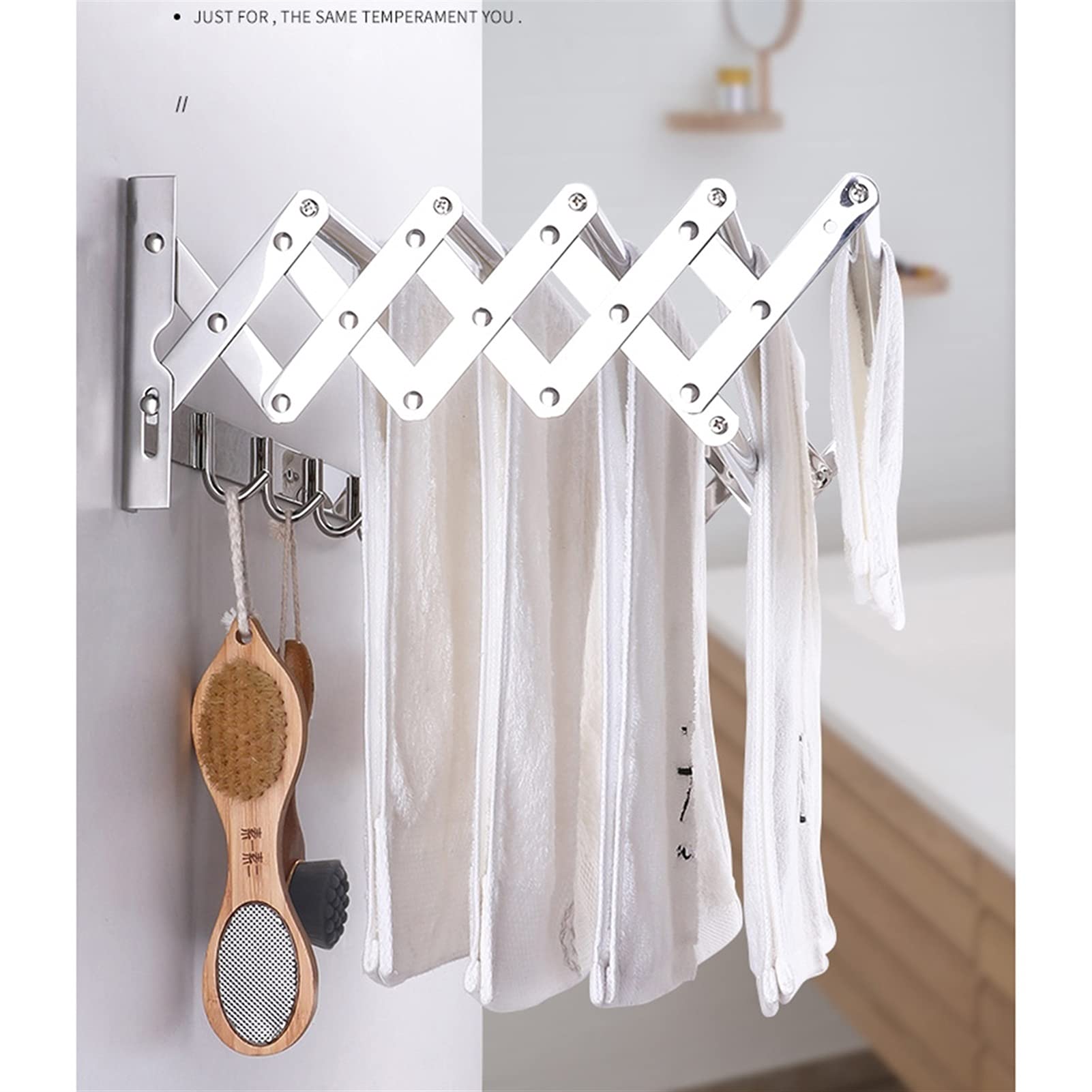 Este tendedero de Ropa de Pared Plegable y retráctil Incluye un toallero con Ganchos para el baño.
