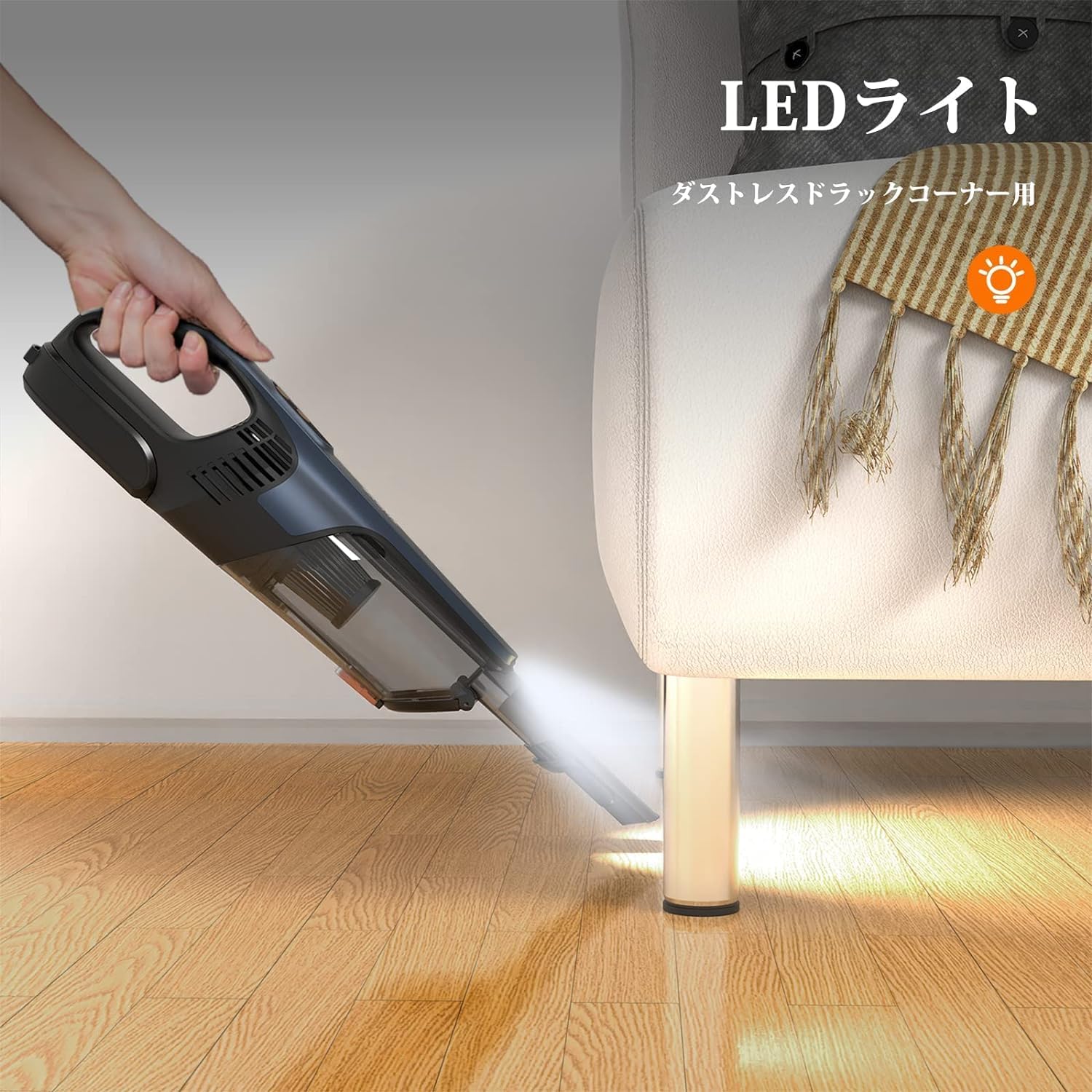 ThiEYE Vackit2 handheld vacuum cleaner with its LED light on, illuminating dust under a sofa, demonstrating its utility in dark areas.