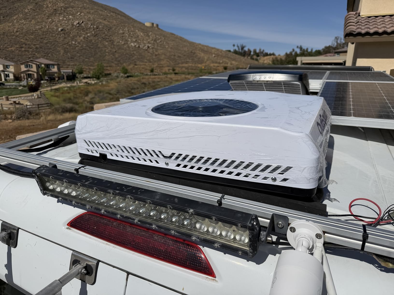 OutEquip compact 28.3x28.3 inch square footprint saves roof space for solar panels, 45 lb unit reduces roof load and boosts fuel efficiency