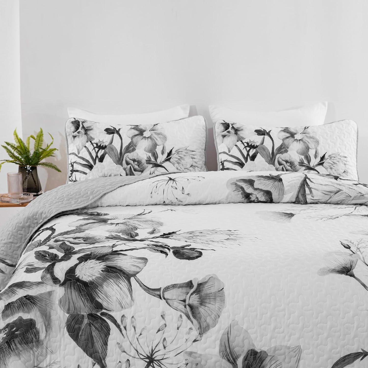 floral quilt set queen grey folded view on bed
