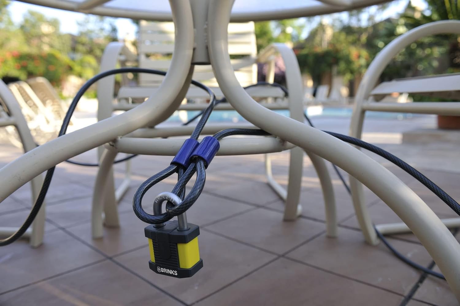 BRINKS cable securing a portable grill with a padlock.