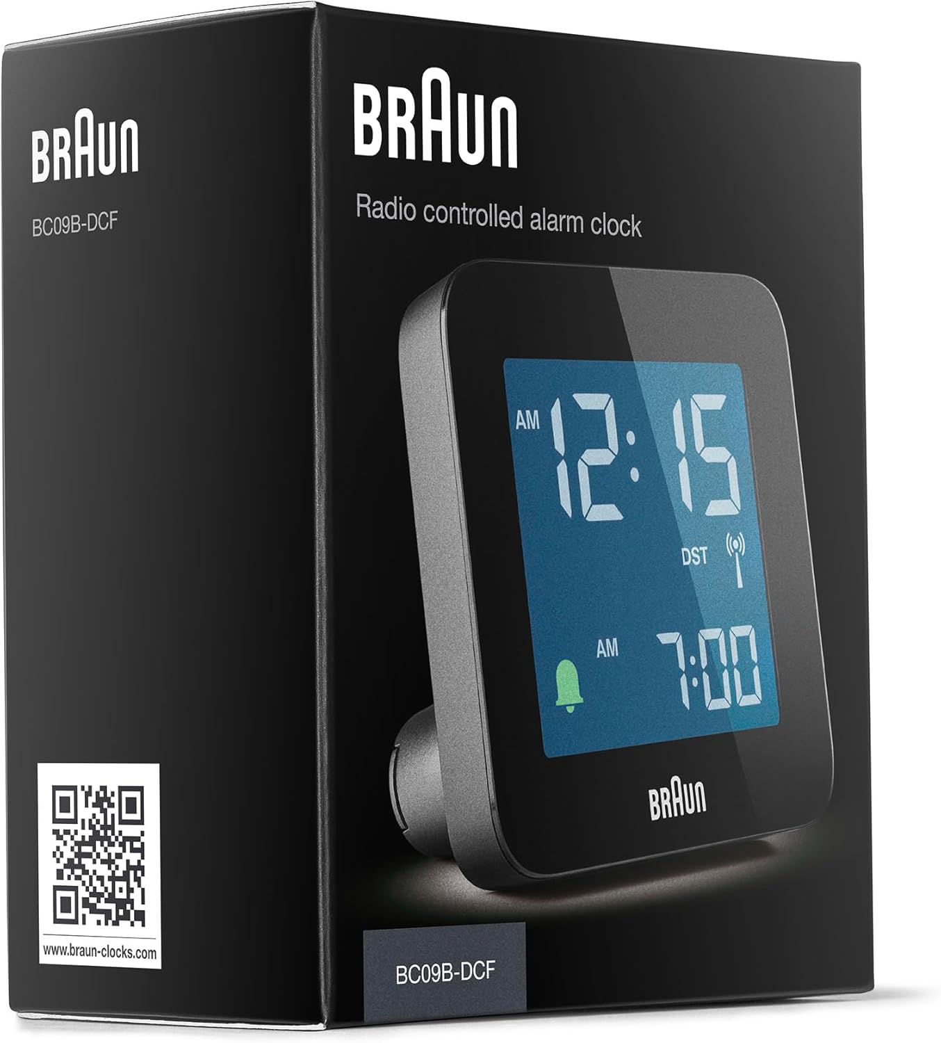 Hand holding Braun BC09B-DCF alarm clock to illustrate its compact size