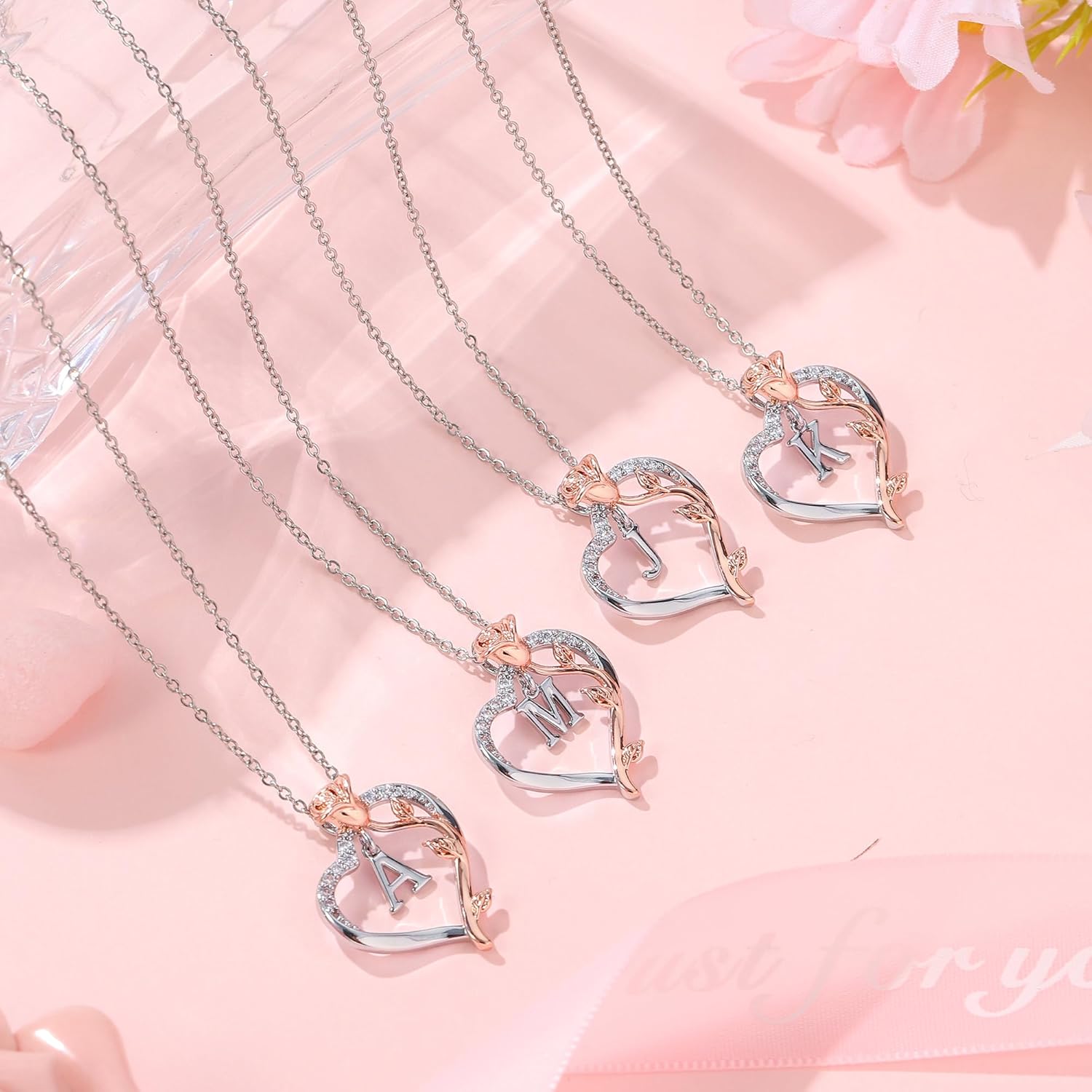 initial necklaces for women close up of pendant and chain