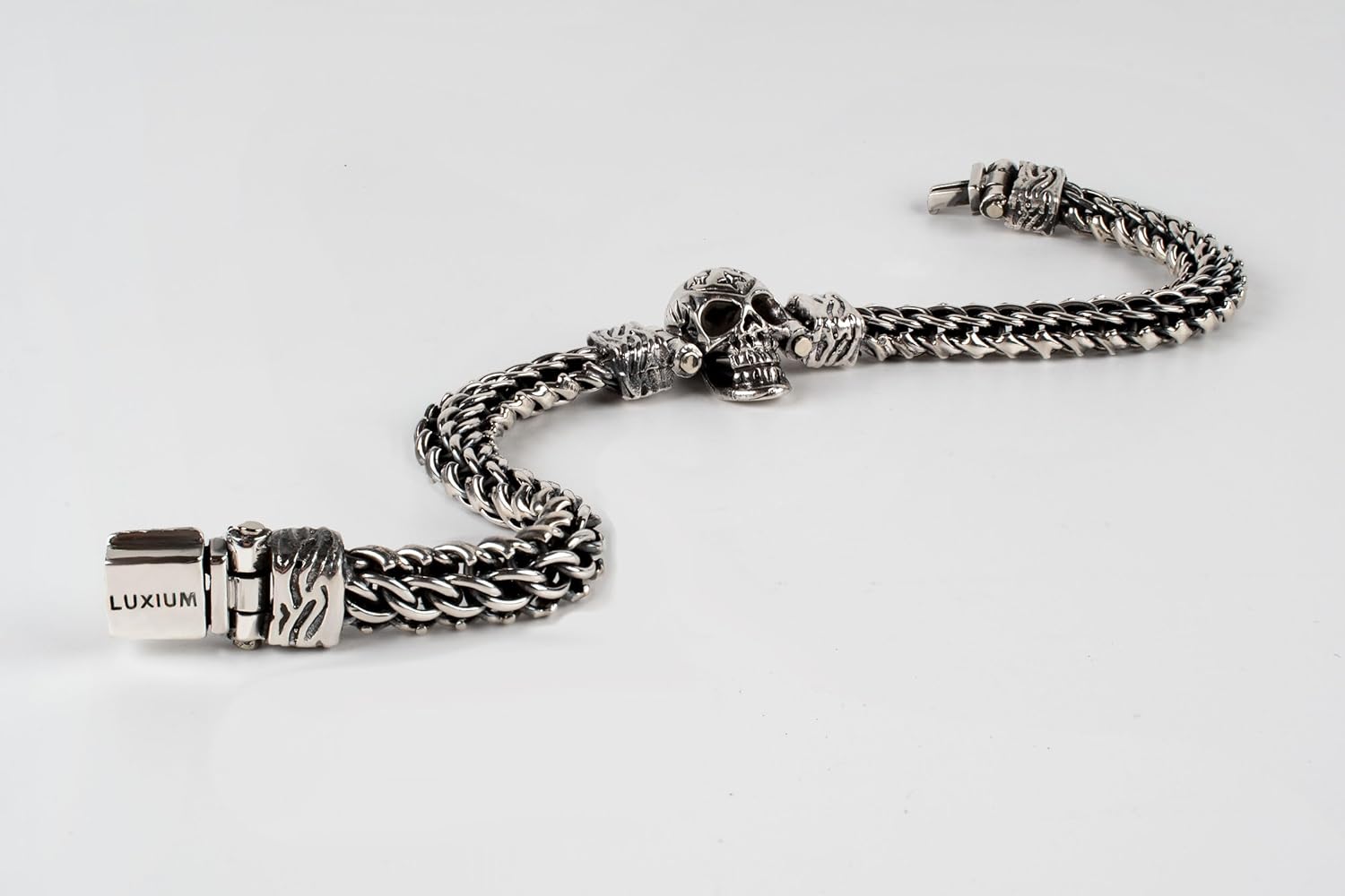 LUXIUM Skull Bracelet: Boldly braided in pure 925 sterling silver, its blackened and polished finishes create a striking balance of depth, distinction, and rebellious elegance.