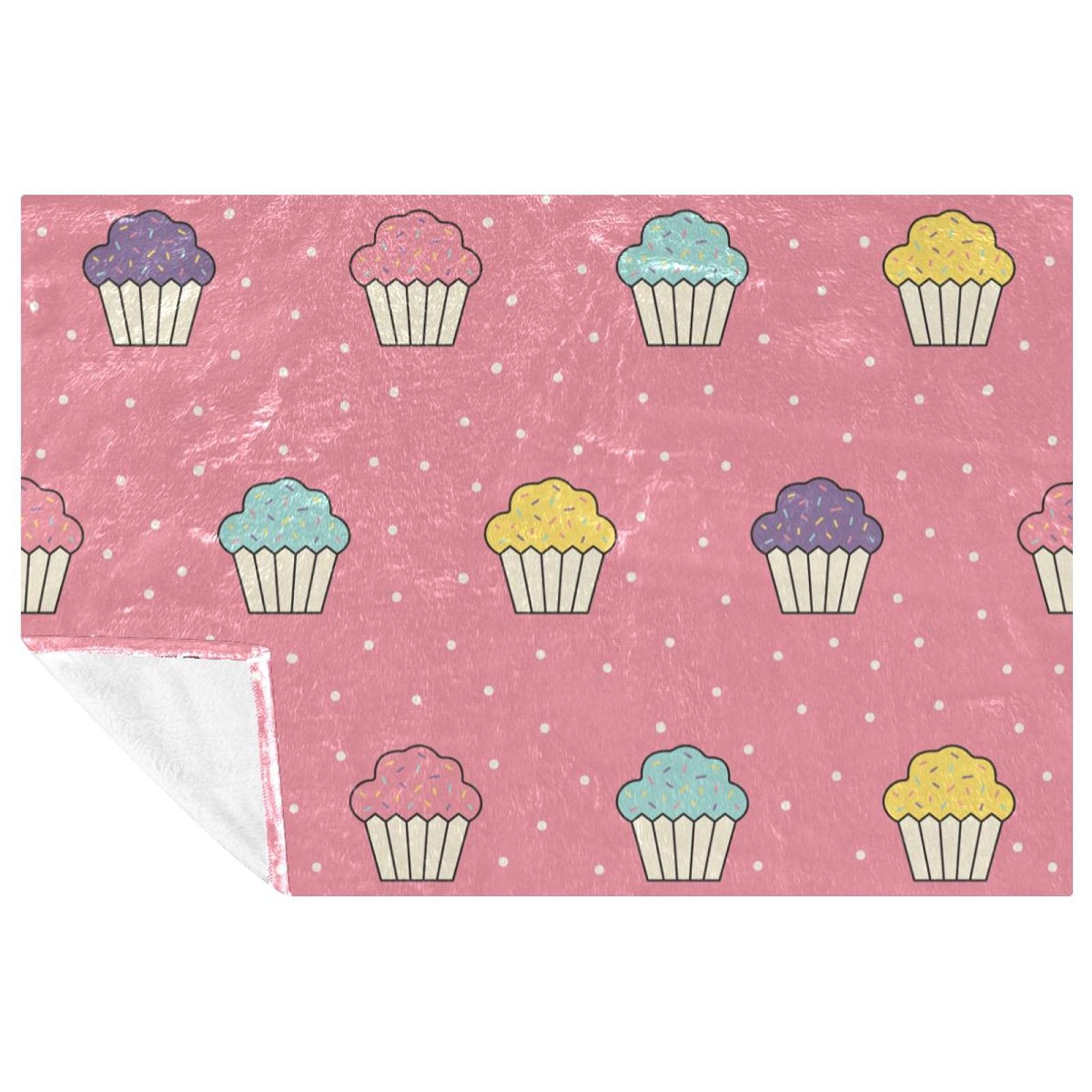 Couverture chaude rose cupcakes contre le froid sur canapé