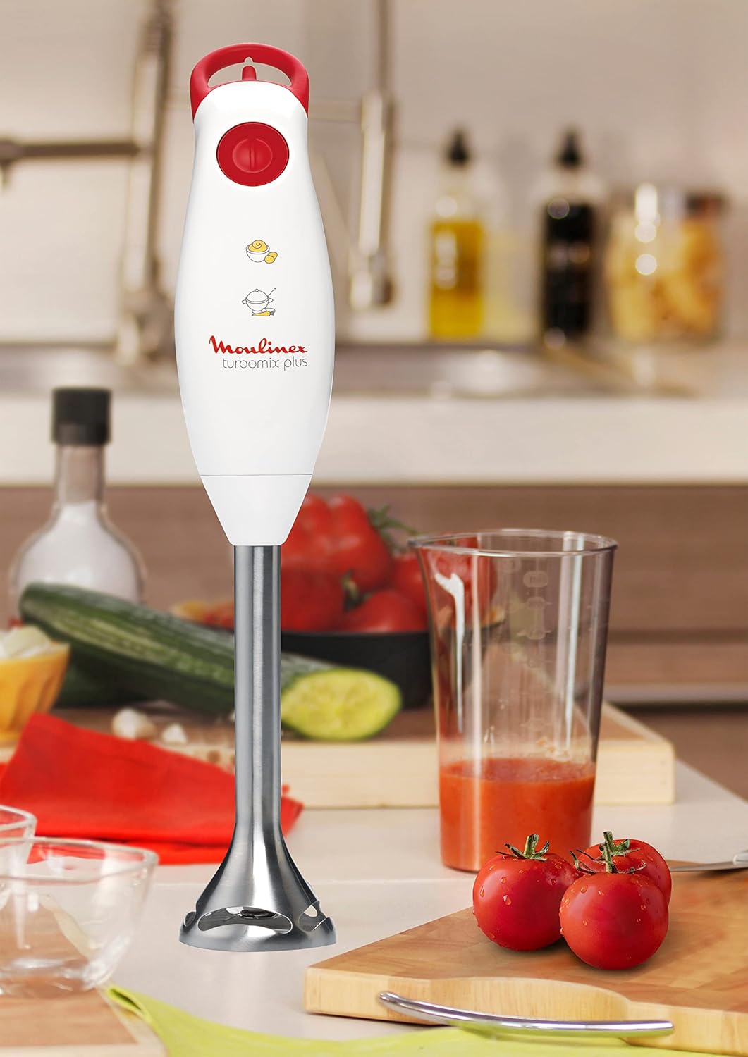 Hand blender in a kitchen setting, ready for use or cleaning
