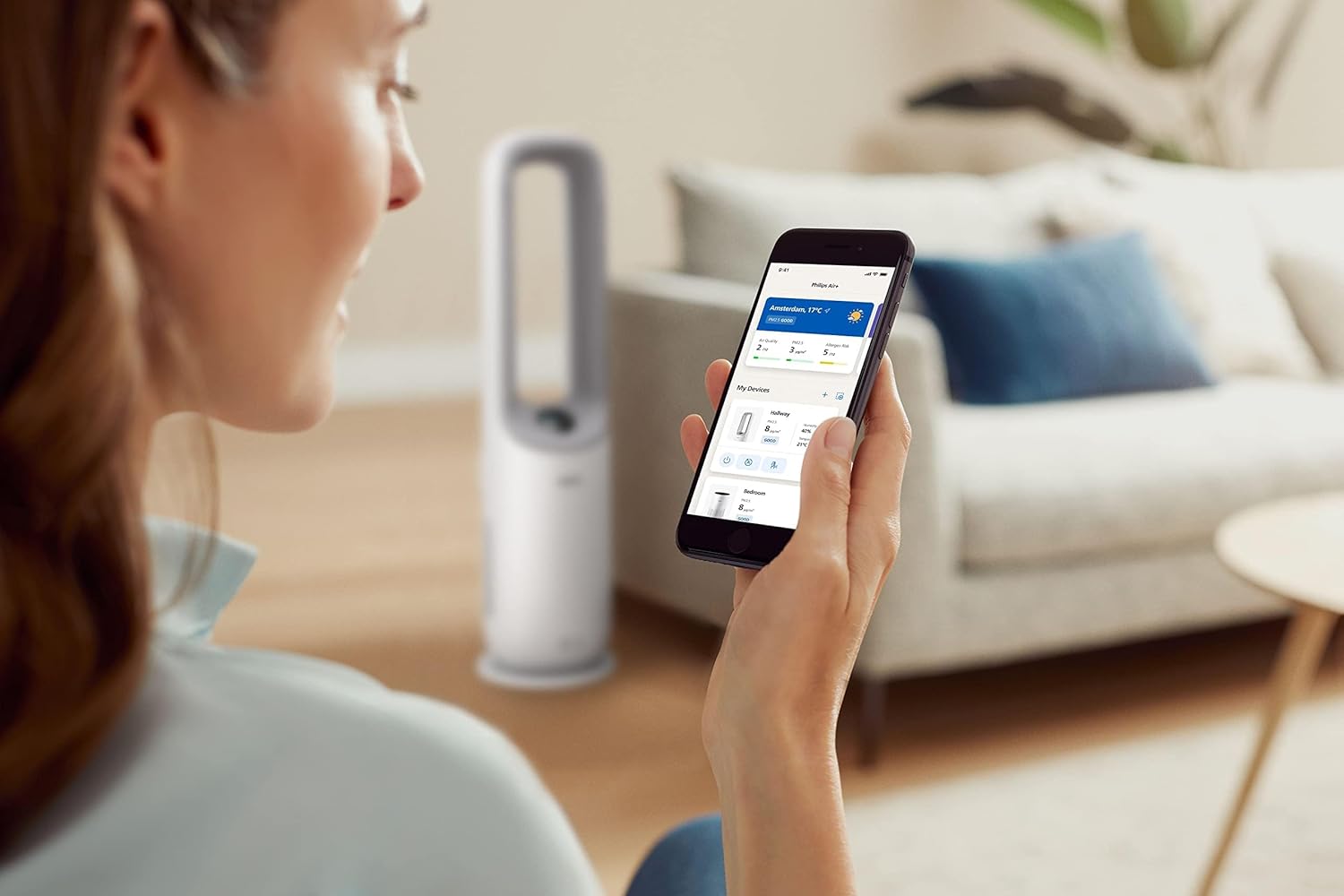 Person using Philips Air+ app to control the Air Performer