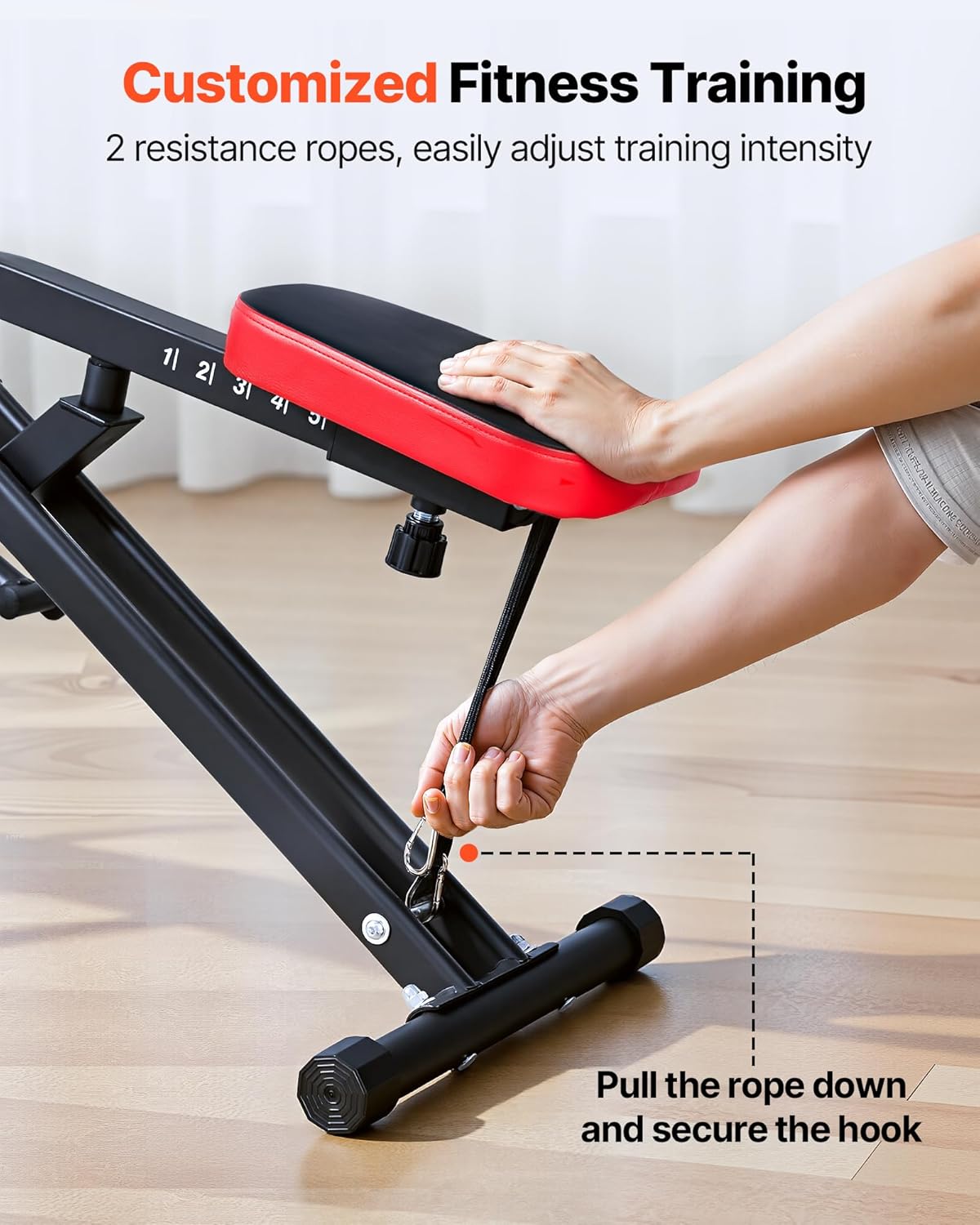 A hand pulling down a resistance rope and securing its hook to adjust the workout intensity on the VEVOR Squat Machine.