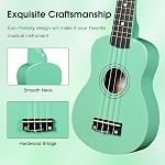 ADM Ukulele pour débutants Hawaïen Wood Ukelele Kit pour adultes étudiant Starter Professional Ukalee Pack ensemble avec des leçons gratuites Gig sac sangle Nylon chaîne Tuner Pick (Cyan Green, 21 De pouce)