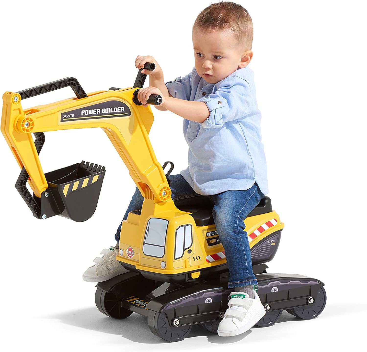Child riding the Falk Power Builder Excavator and operating the shovel