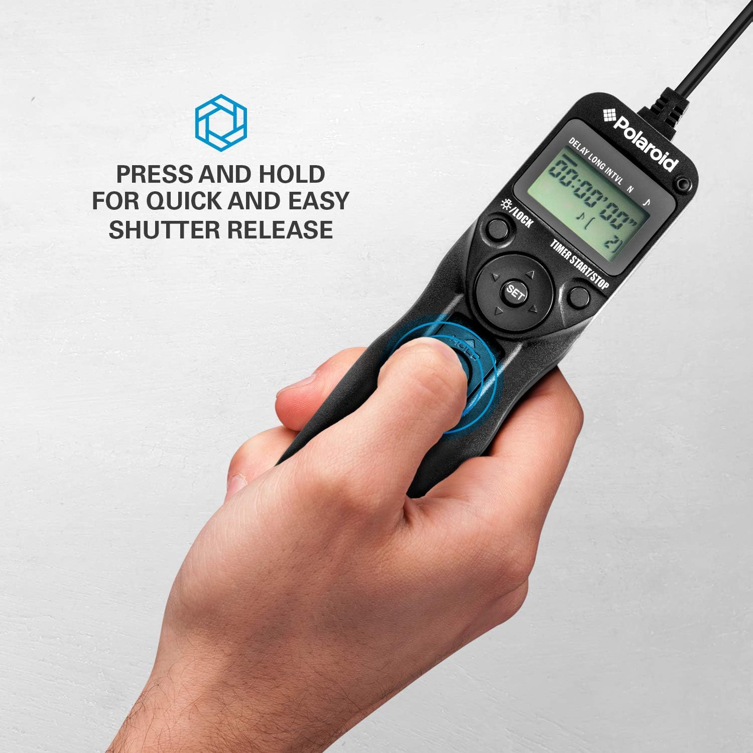 Image of a hand pressing the shutter release button on the Polaroid PLRTC18 remote control.