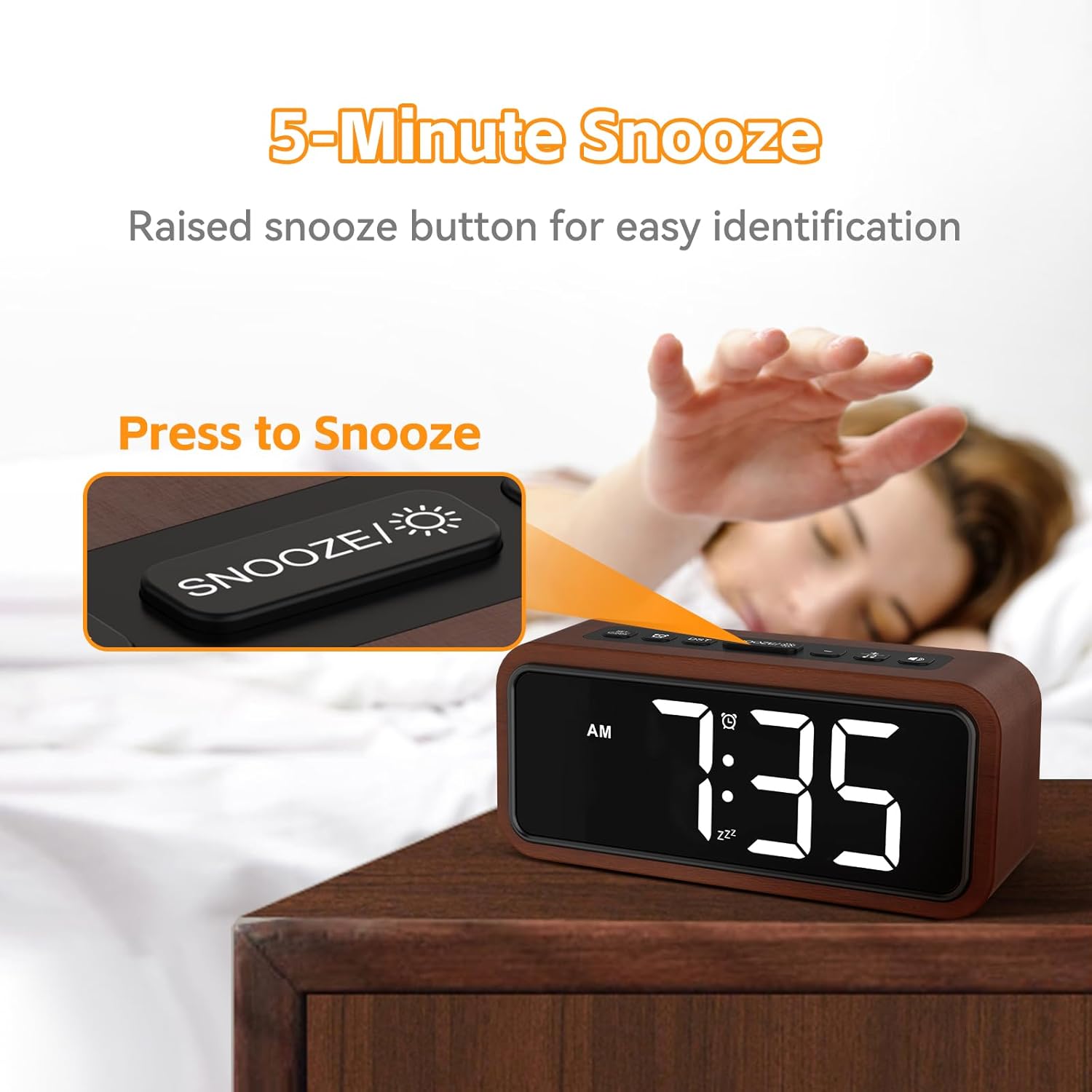 Hand pressing the snooze button on the alarm clock