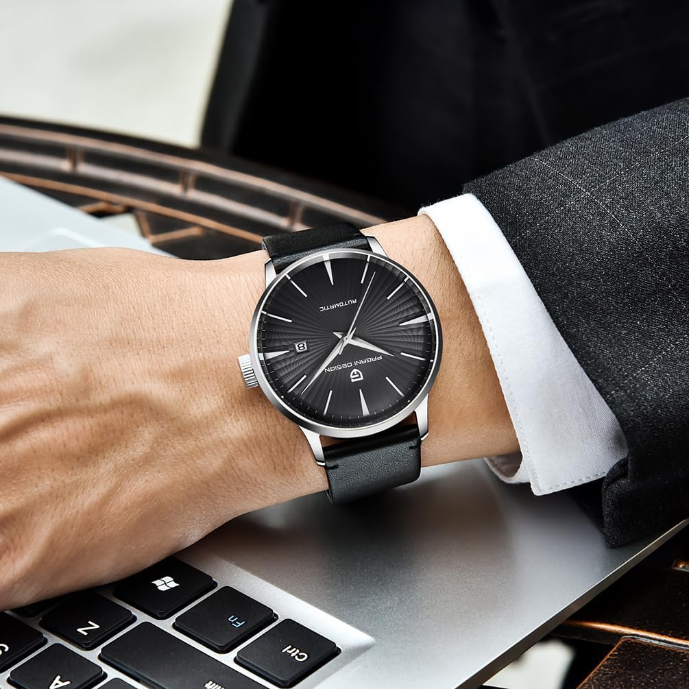 Pagani Design PD2770 watch on a person's wrist, next to a laptop.