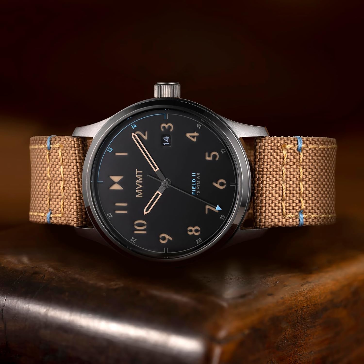 Close-up of MVMT Field II watch face showing the crown and date window