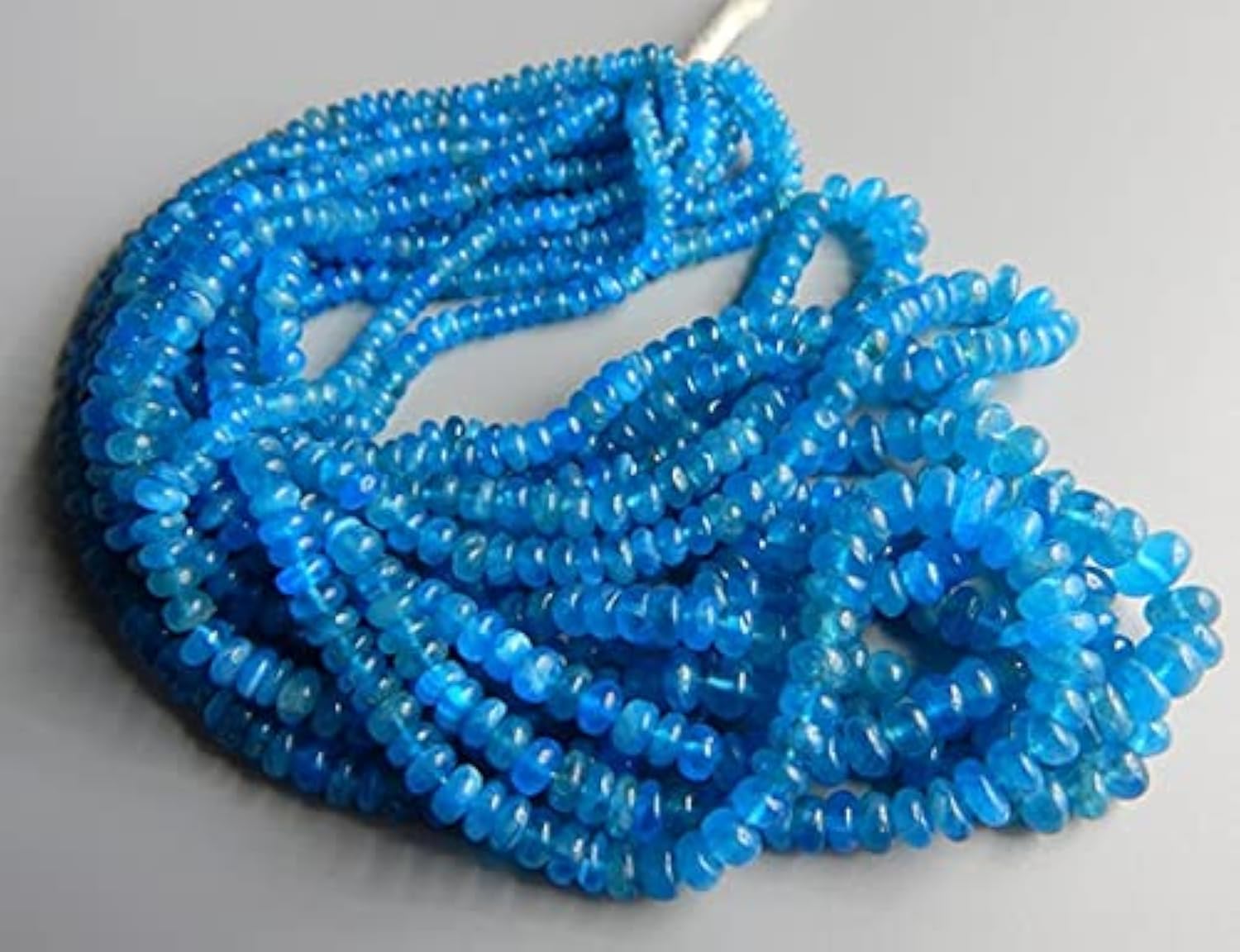 Perles apatite rondelles lisses 7x3mm pour création bijoux fil 18 pouces
