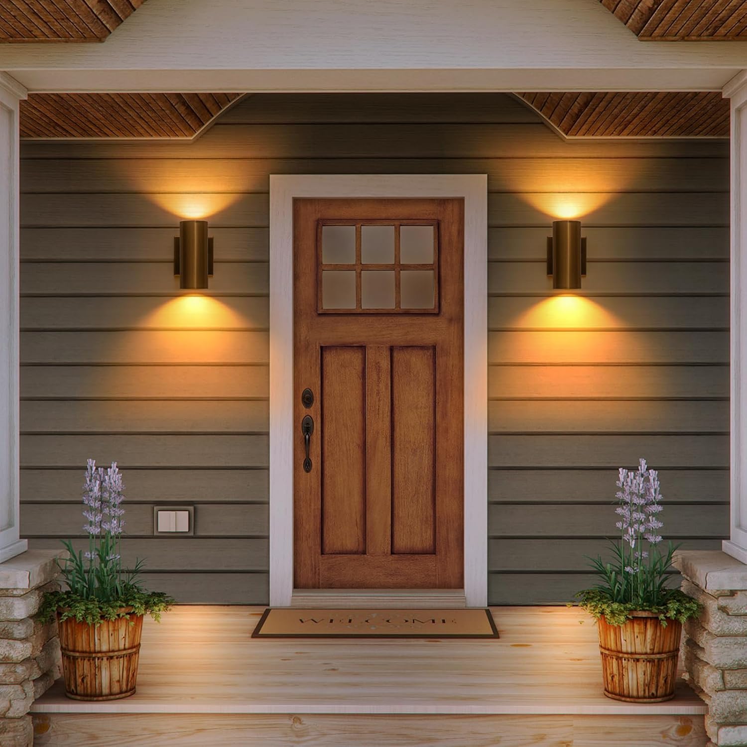 Two Zicbol gold wall lights installed on either side of a front door, illuminating the porch area.
