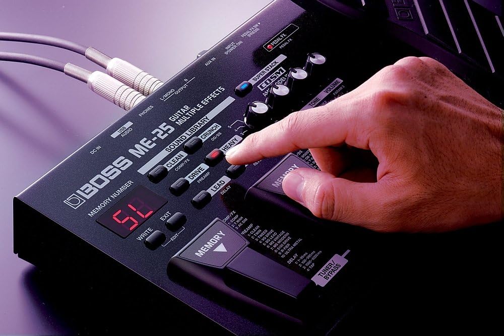 Close-up of a hand adjusting a knob on the BOSS ME-25