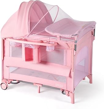 JOYMOR 9 in 1 Bedside Bassinet with Changing Table, Pack and Play with Bassinet, Convert to Rocking Baby Bed with Electric Music Center, Mosquito Net, Storage,Pink