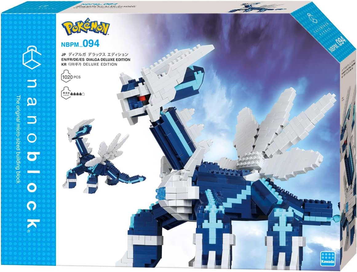 Contents of the nanoblock Pokémon Dialga DX kit, showing bags of sorted blocks and an instruction manual
