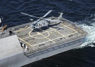 Posterazzi Atlantic Ocean September 28 2009-The littoral combat ship USS Freedom (LCS-1) conducts flight deck certification with an MH-60S Sea Hawk helicopter Poster Print, (16 x 12)