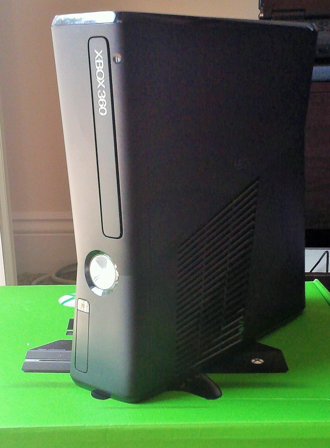 Xbox 360 S console standing vertically