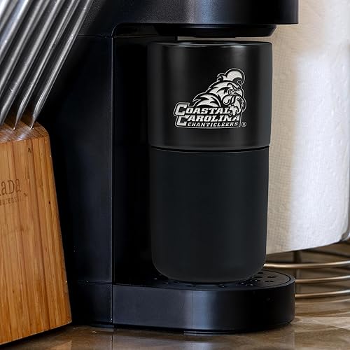 Miniatura 239 de Rico Industries NCAA Miami of Ohio Redhawks - Vaso de cerámica de 16 onzas con agarre de silicona, grabado láser profundo, diseño de color negro