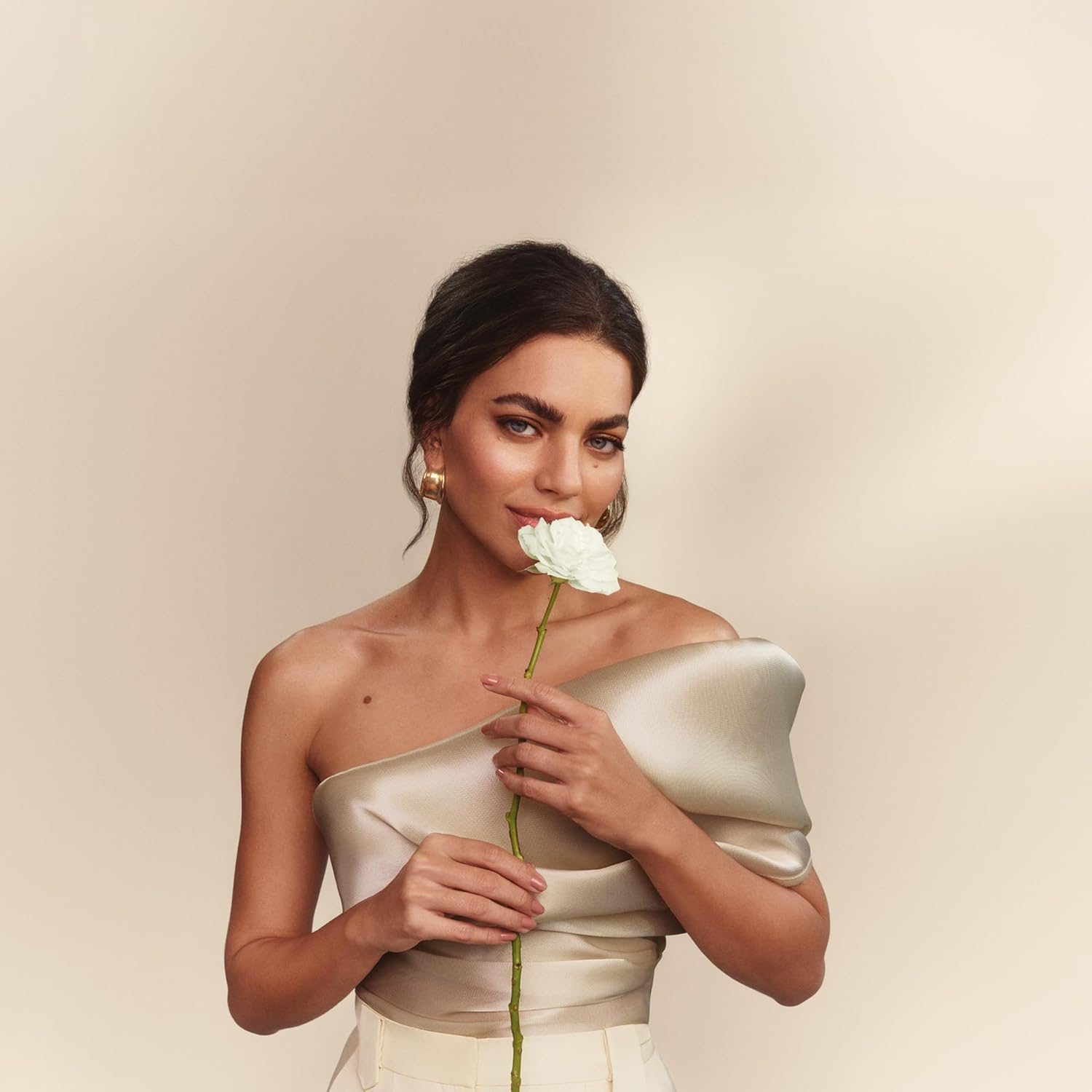 Woman holding a white rose