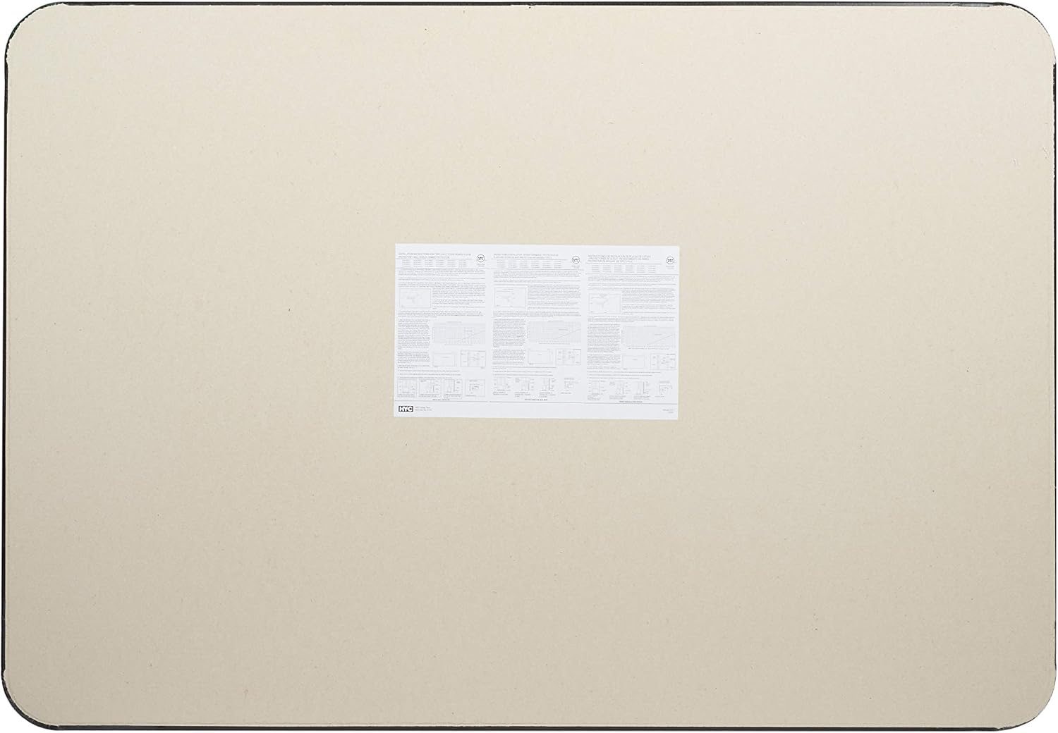 The underside of the HY-C stove board, showing the fiber board backing and a label with product information and warnings.