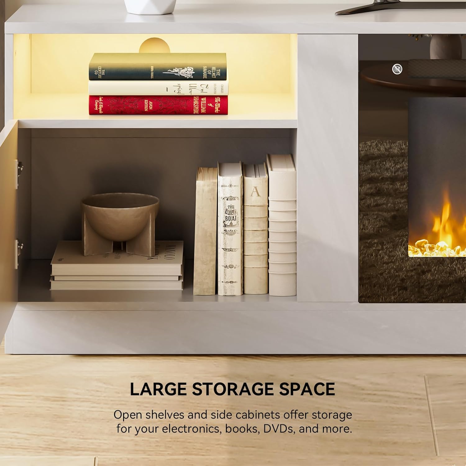 Close-up view of the TV stand's open shelves and closed cabinets, filled with books and decorative items, demonstrating large storage capacity.
