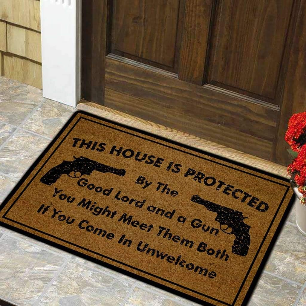 Funny Door Mat Non-Slip Back Rubber Entry Way Doormat Outside | This House is Protected by The Good Lord and a Gun | Standard Outdoor Welcome Mat | Non-Woven Fabric 18 Inch x 30 Inch