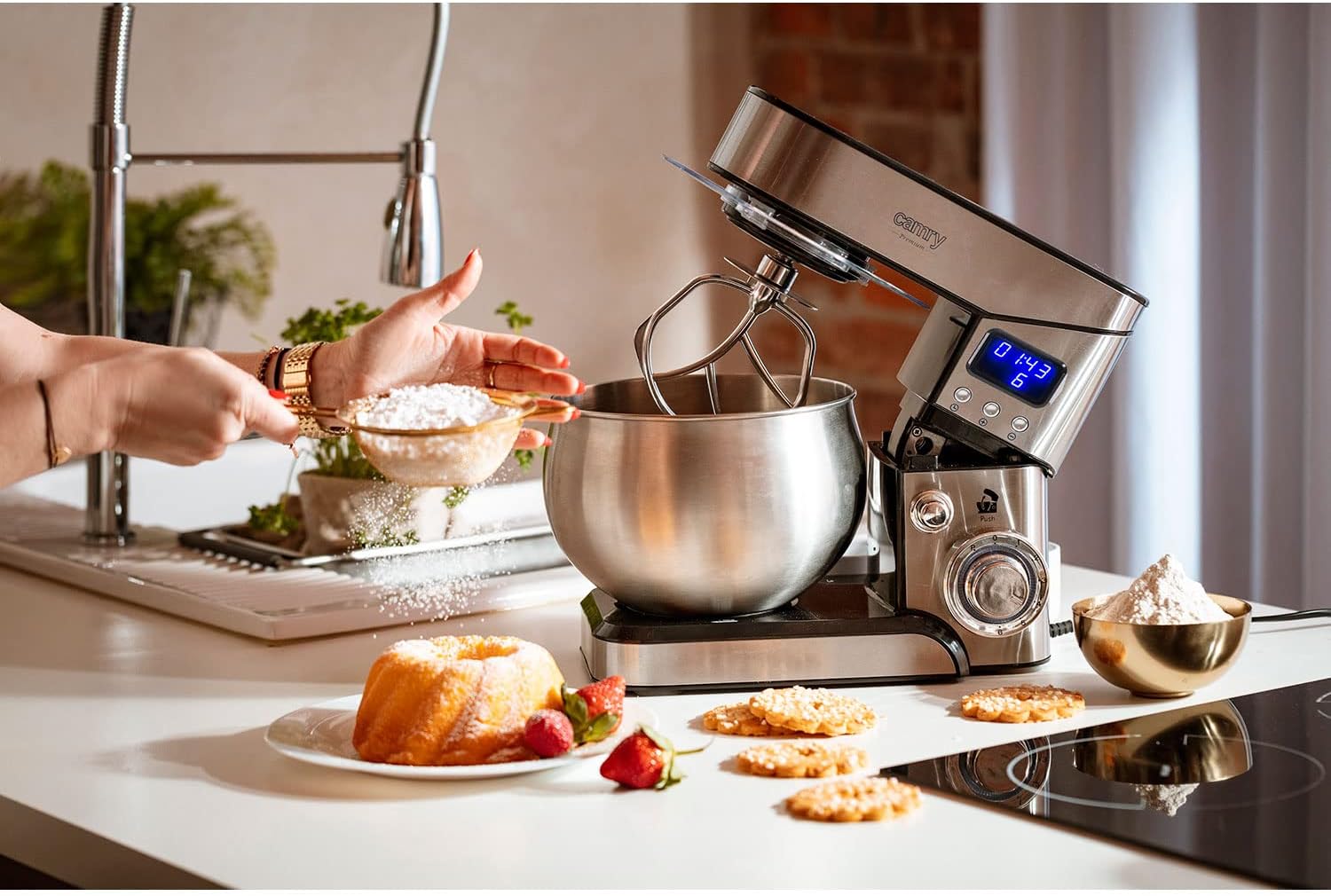 Adler Camry CR 4223 Food Processor in a kitchen setting, with a person sifting flour into the mixing bowl.