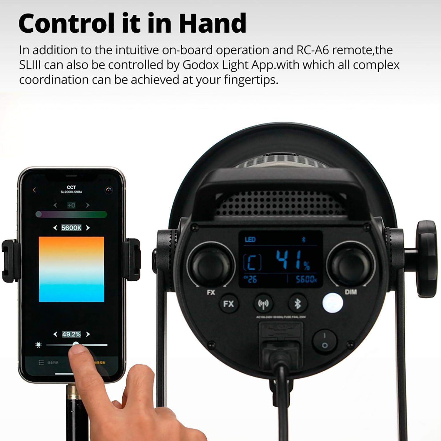A hand holding a smartphone displaying the Godox Light App interface, controlling the Godox SL300III LED video light