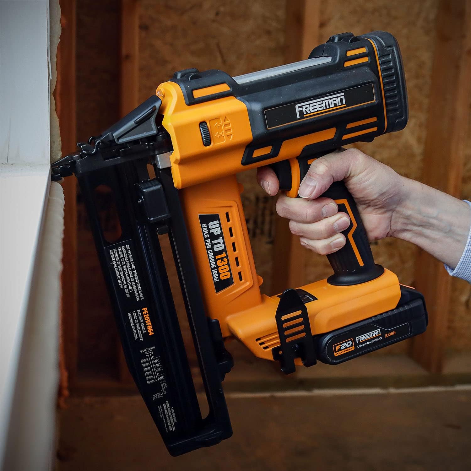Close-up of the select fire button on the Freeman PE20VFN64 nailer, showing options for single or bump firing.