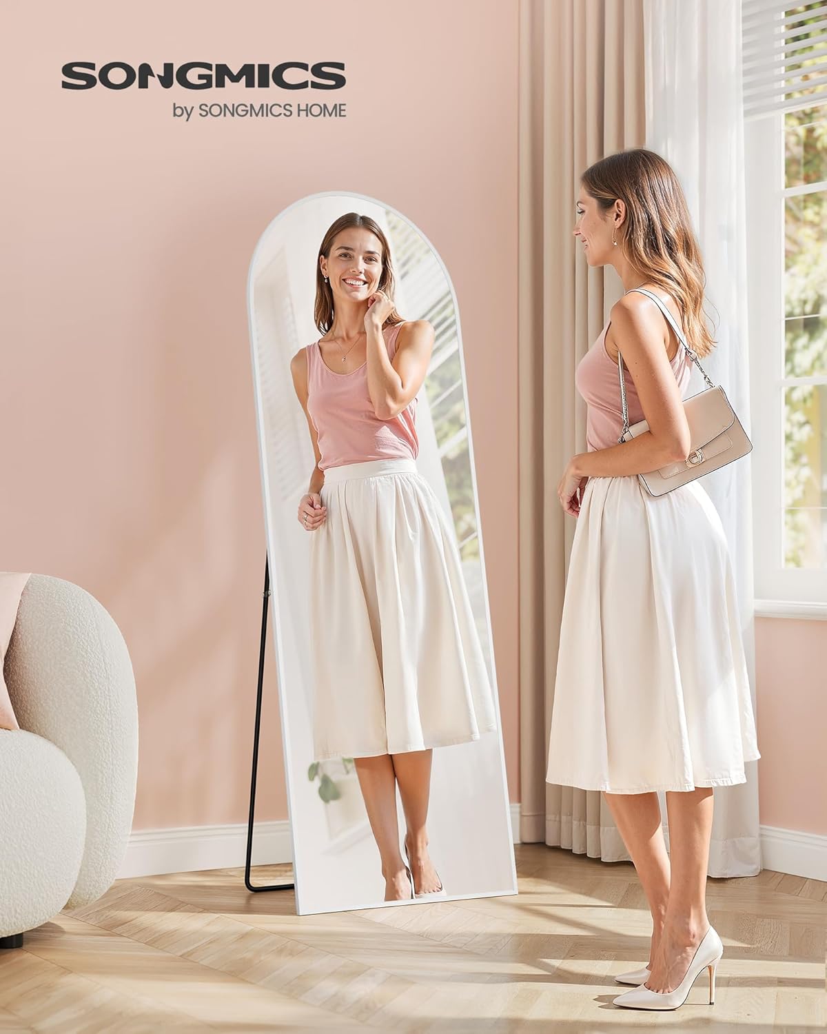Woman standing in front of SONGMICS Full-Length Arch Mirror