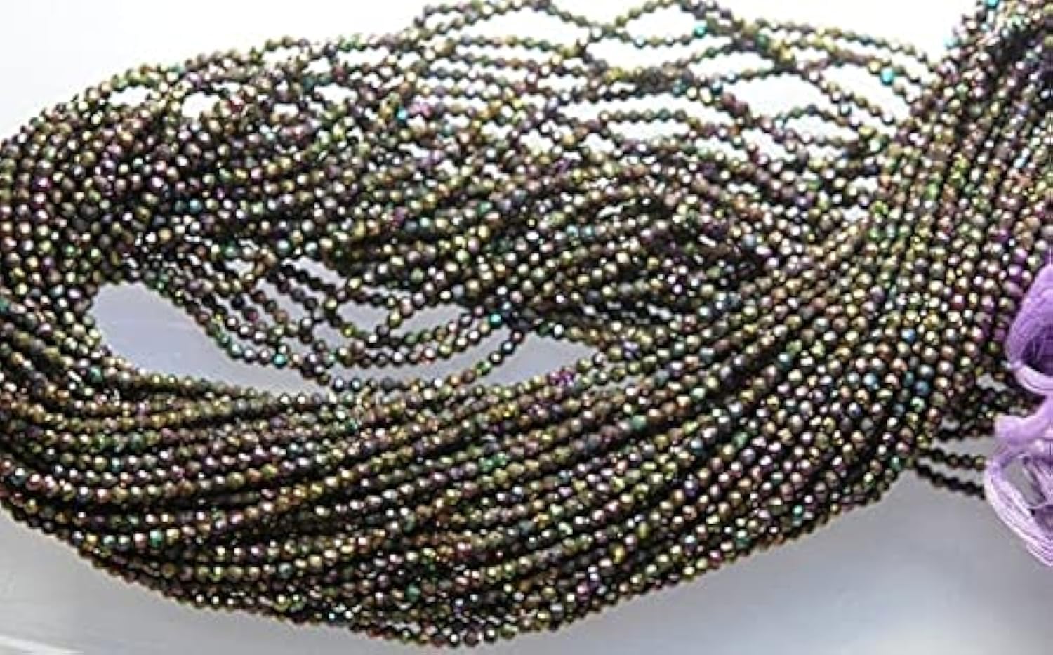 Spinelle noir et violet facetté 2.10mm les perles d'exception pour un bijou chargé d'émotions