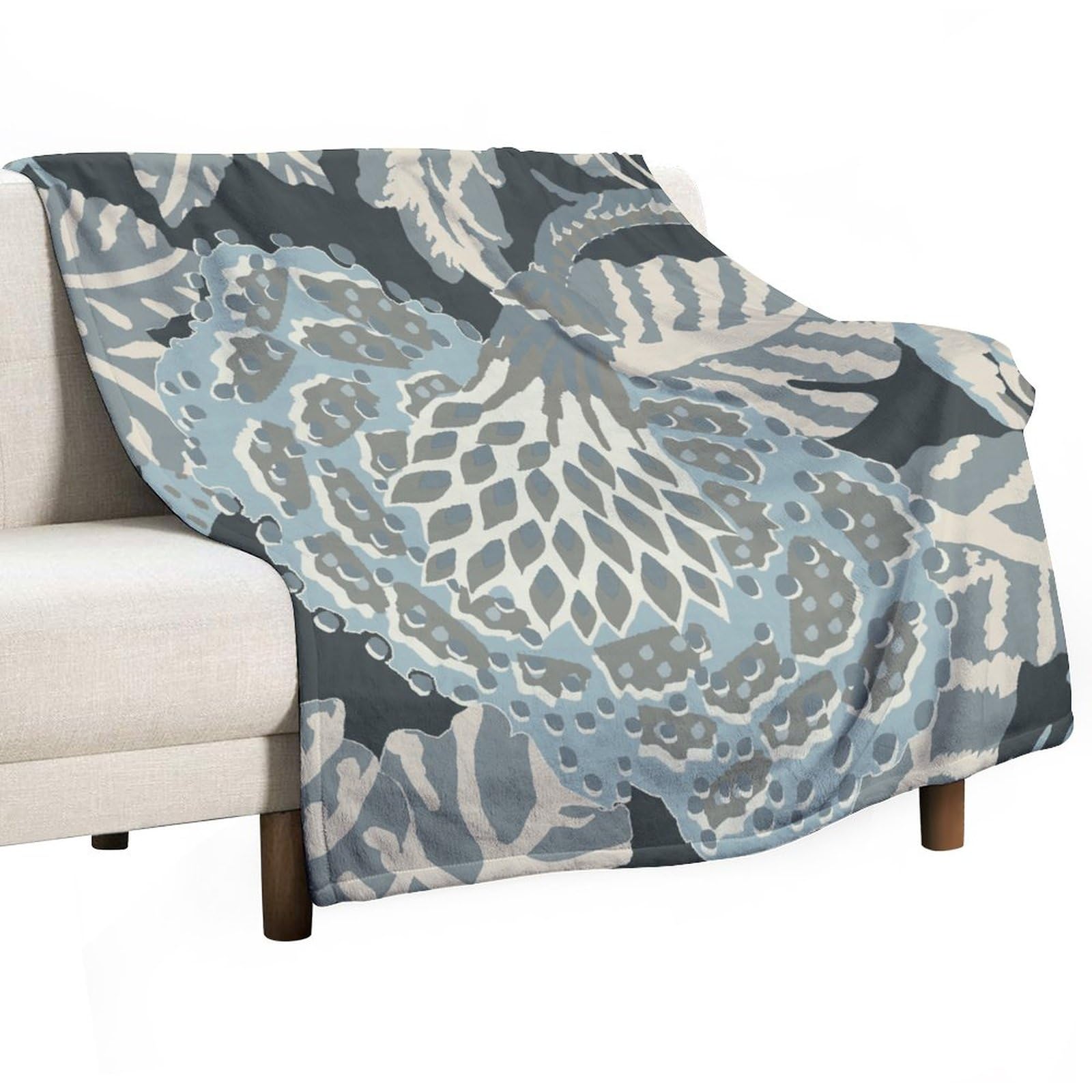 Plaid pelucheux floral vert et bleu pour réchauffer vos soirées salon