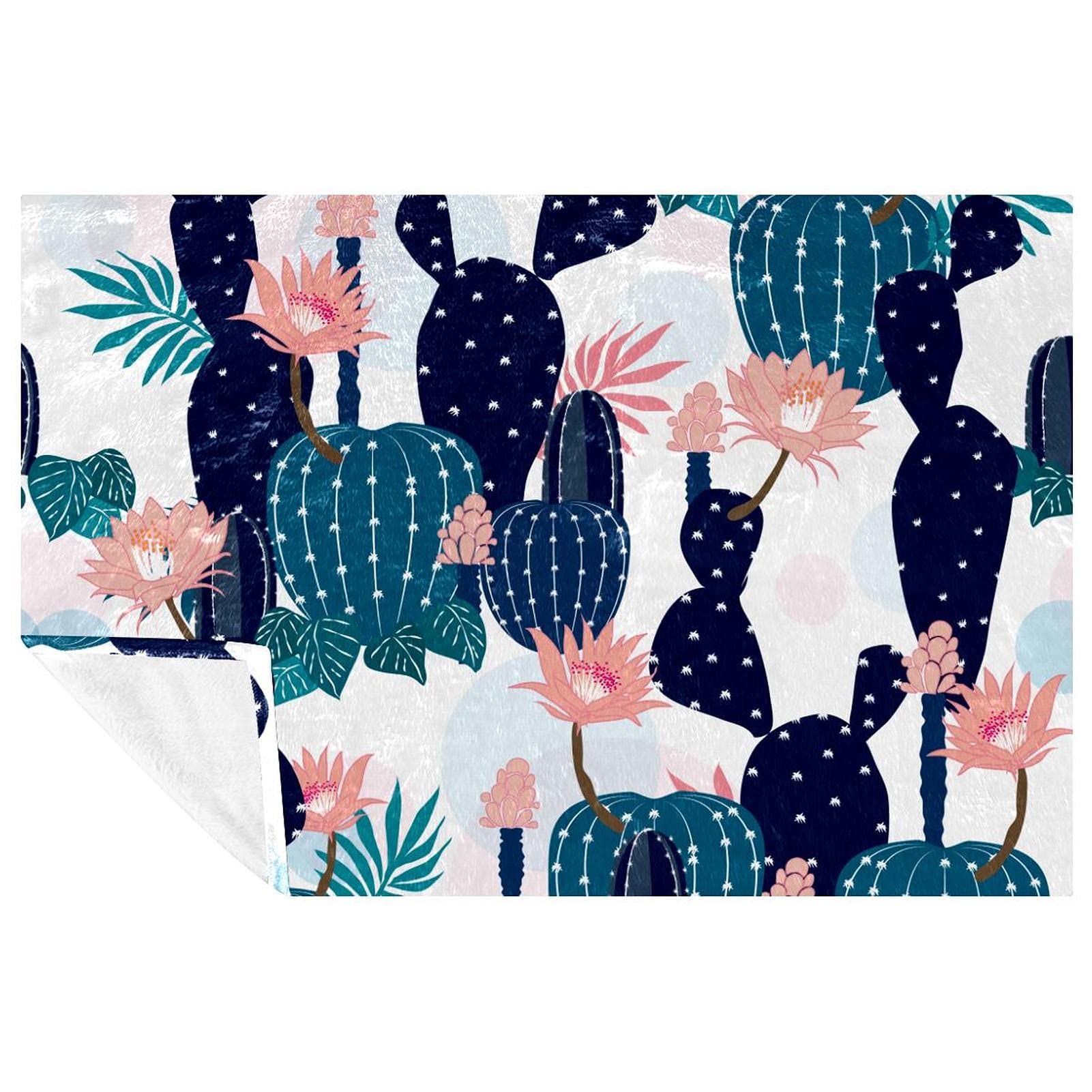 Couverture douce cactus et fleurs : votre allié confort du canapé au camping de plage