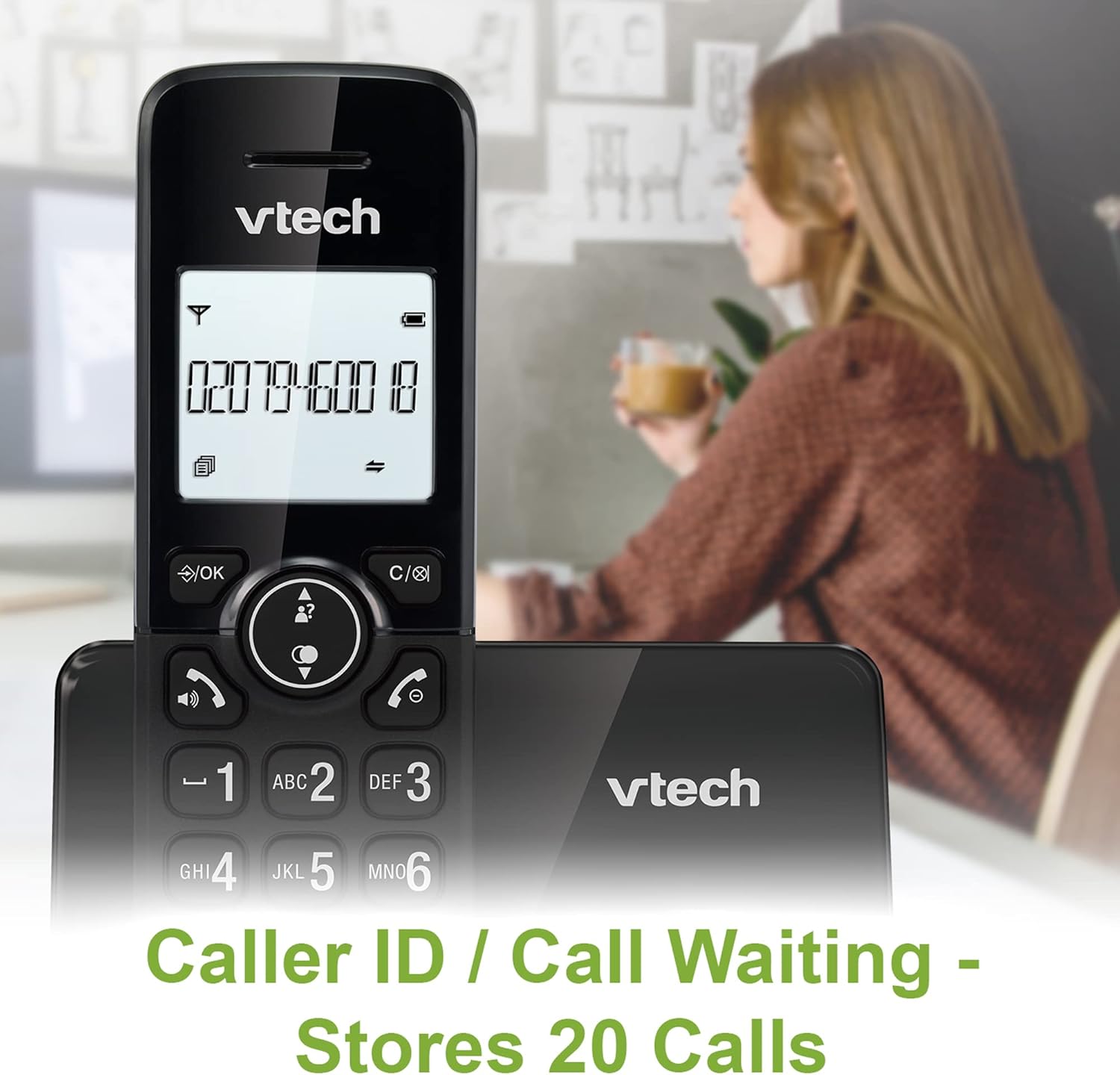 A VTech CS2001 handset on its base, displaying a phone number on its screen, with a person in the background.