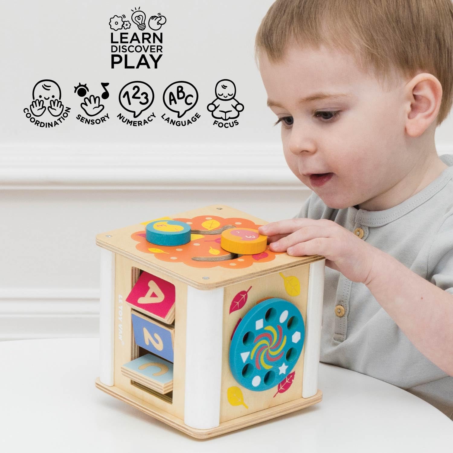 Le Toy Van – Pädagogischer Petilou Multi-Sensorikwürfel aus Holz mit Drehrad | Für Mädchen & Jungen | Geeignet für Kinder ab 2 Jahren