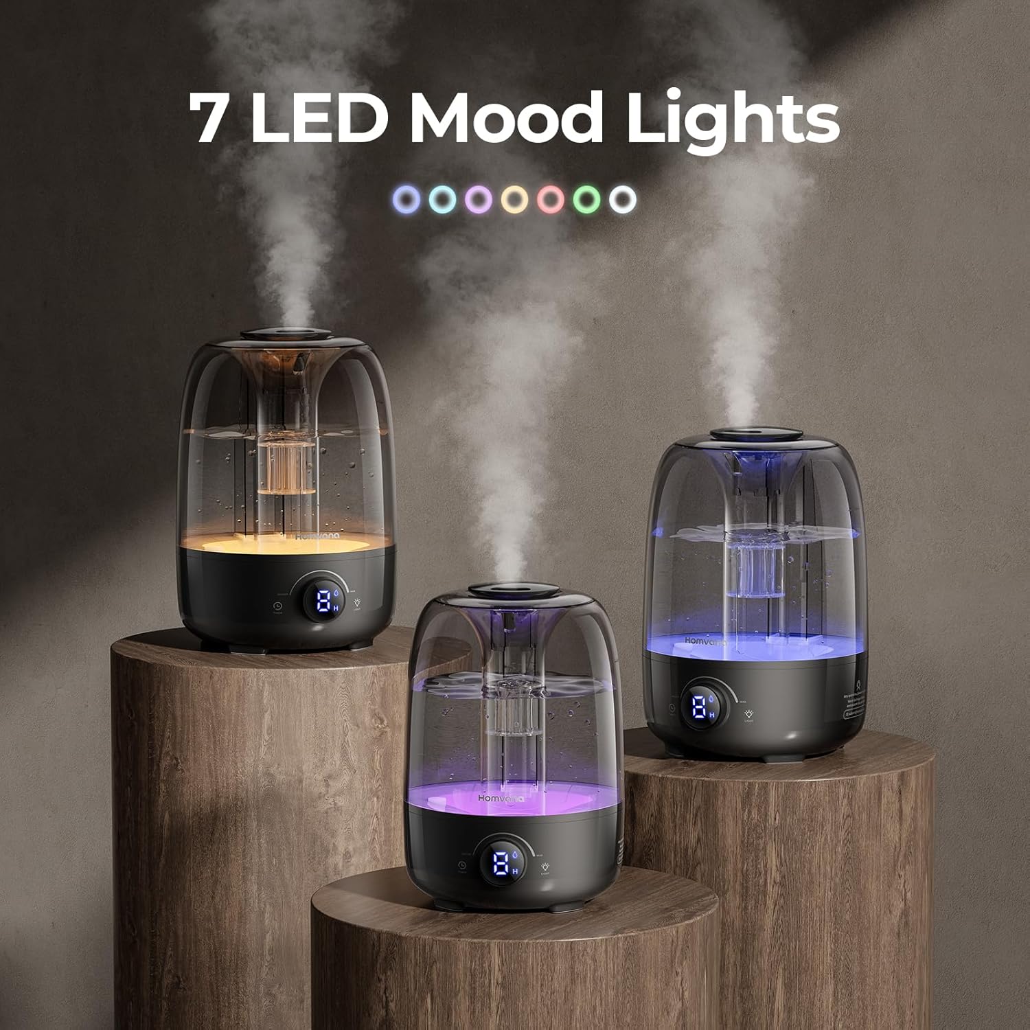 Three Homvana H104 humidifiers displaying different LED mood light colors